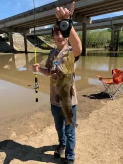 Damion and his catfish in creek